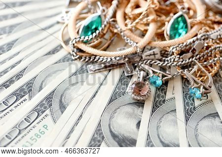 Many Expensive Golden And Silver Jewerly Rings, Earrings And Necklaces On Big Amount Of Us Dollar Bi