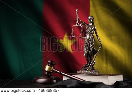 Cameroon Flag With Statue Of Lady Justice, Constitution And Judge Hammer On Black Drapery. Concept O