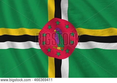 Dominica Flag With Big Folds Waving Close Up Under The Studio Light Indoors. The Official Symbols An