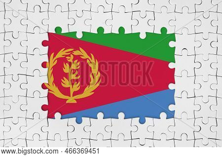 Eritrea Flag In Frame Of White Puzzle Pieces With Missing Central Parts