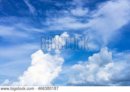 Clouds In The Blue Sky. Natural Sky Background Texture, Beautiful Color. Peaceful Blue Sky With Ligh