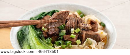 Beef Noodle Soup. Taiwanese Famous Food In A Bowl On Wooden Table.