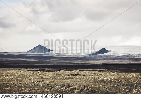 Moody Ocean Waves Hitting The Shore Of Iceland On Cold Autumn Day Without Sun