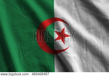 Algeria Flag With Big Folds Waving Close Up Under The Studio Light Indoors. The Official Symbols And
