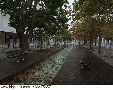 Lisbon, Portugal, October 30, 2021: Tree Alley And Water Fontain Vulcao De Agua At Alameda Dos Ocean
