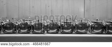 Many Coffee Pots Stand Side By Side In One Compartment.