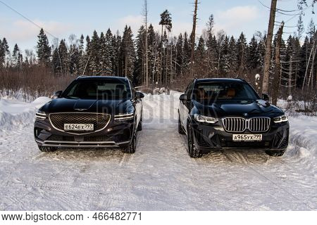 Moscow, Russia - February 05, 2022 Bmw X3 (g01) And Genesis Gv70 (jk1), A Compact Crossover Suv Car 