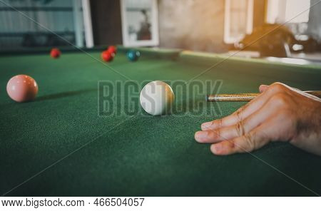 Close Up On Hand's Snooker Player And White And Red Snooker Ball Or Pool On The Snooker Table. The C