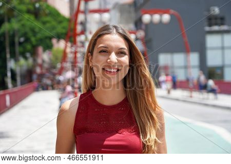 Close-up Of Beautiful Woman Walking In Sao Paulo Neighborhood Liberdade, Brazil, South America