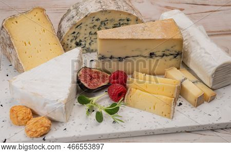 Cheese Collection, Marble Board With French Cheeses Brie, Tomme, Matured Goat Cheese, Morbier  Serve
