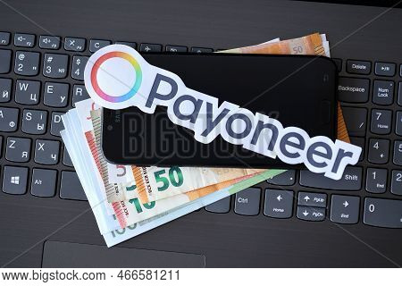 Ternopil, Ukraine - September 6, 2022 Payoneer Paper Logotype Lies On Black Laptop Keyboard With Eur