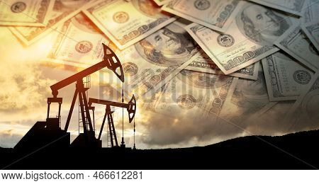 Oil Price Cap Concept. Petroleum, Petrodollar And Crude Oil Concept. Oil Pump On Background Of Us Do