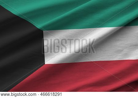 Kuwait Flag With Big Folds Waving Close Up Under The Studio Light Indoors. The Official Symbols And 