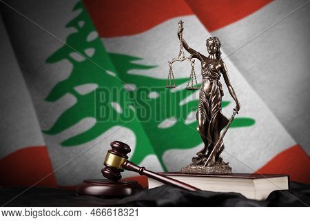 Lebanon Flag With Statue Of Lady Justice, Constitution And Judge Hammer On Black Drapery. Concept Of