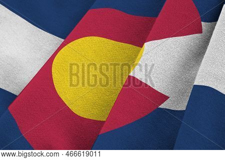 Colorado Us State Flag With Big Folds Waving Close Up Under The Studio Light Indoors. The Official S