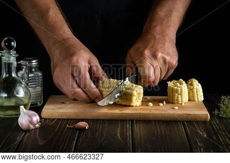 The Cook Cuts Boiled Corn Kernels With A Knife. Maize Is An Excellent Dietary Breakfast Or Lunch By 