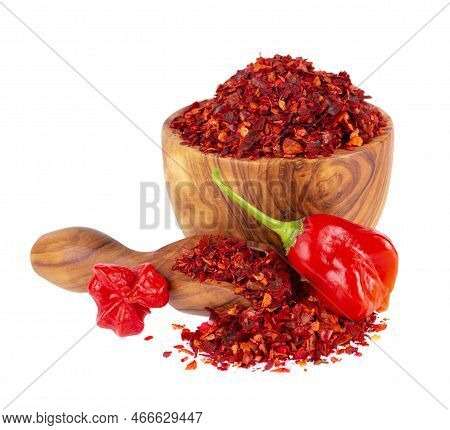 Fresh And Dry Ground Red Chili Peppers Isolated On White Background. Capsicum Baccatum Or Bishops Cr