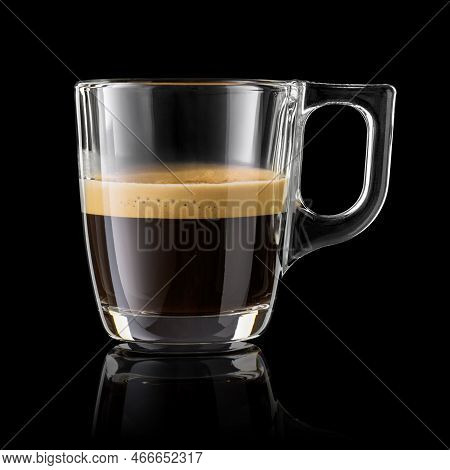 Half Cup Of Espresso Coffee Isolated On Black Background.