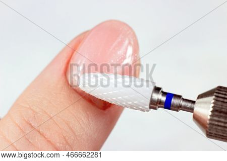 Woman Hands Making Self Manicure Removing Pink Gel Nail Polish At Home With The Help Of Electrical F