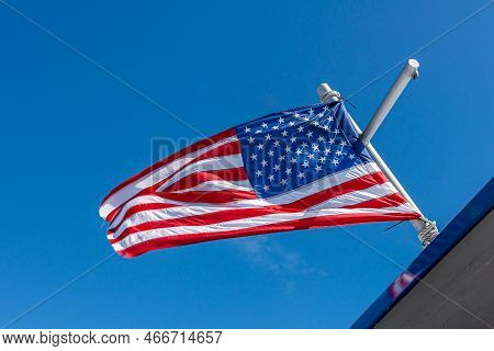 Seward, Alaska, Usa - July 22, 2011: Closeup Of Open Flowing Usa National Flag, Stars And Stripes, A