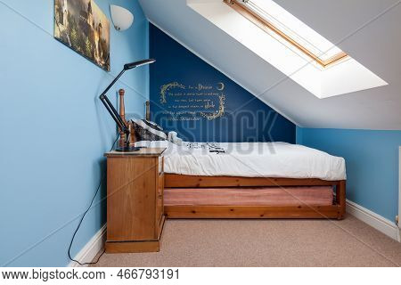 Bottisham, Cambridgeshire, England - October 16 2018: Modern Furnished Attic Style Bedroom With Velu