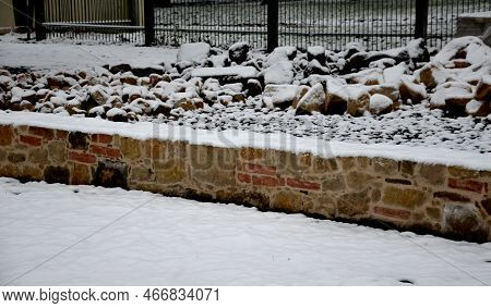 Stone Pavement Just Laid Dry In The Gravel Backfill Between Two Sheet Steel Curbs. Sandstone And Pie