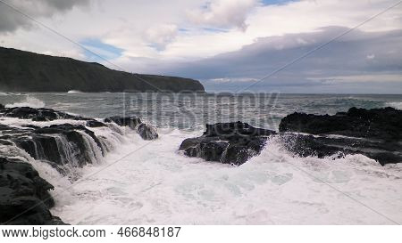 Waves Crashing Against Rocks. Windy Weather In Sao Miguel, Azores. Piscinas Naturais Caneiros Natura