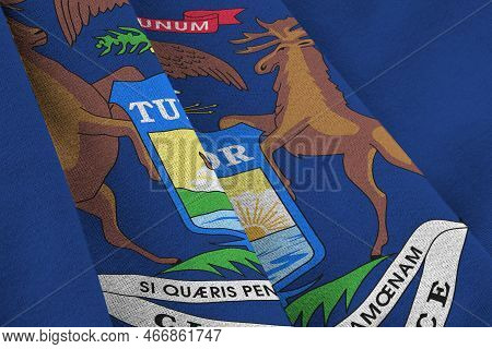 Michigan Us State Flag With Big Folds Waving Close Up Under The Studio Light Indoors. The Official S