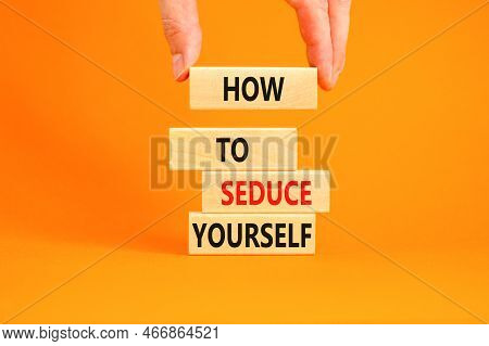How To Seduce Yourself Symbol. Concept Word How To Seduce Yourself On Wooden Blocks. Businessman Han