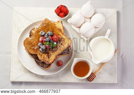 Several Pieces Of French Toast - White Wheat Bread Soaked In Egg, Milk And Sugar, Fried On A Pan - S