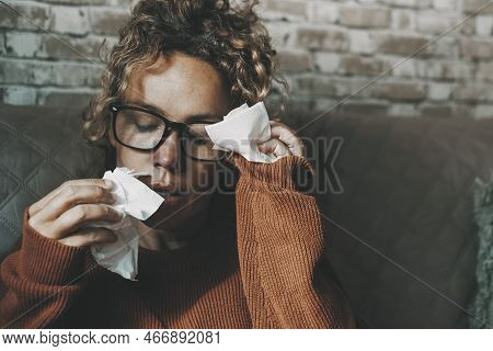 Portrait Of Woman In Bad Health Condition Using Tissues And Touching Front For Headache. Flu Virus I