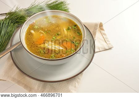 Hot Steaming Winter Soup From Chicken, Vegetables And Parsley In A Bowl, Home Remedy Against Cold An
