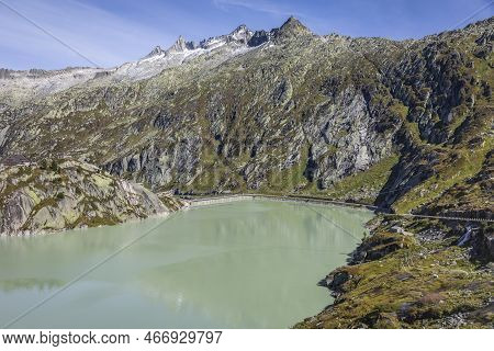 Alpine Lake At Oberalp Pass In Graubunden Alps, Grisons, Switzerland