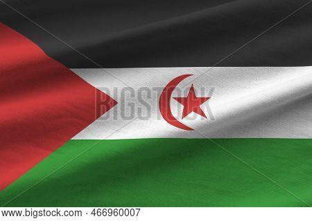 Western Sahara Flag With Big Folds Waving Close Up Under The Studio Light Indoors. The Official Symb