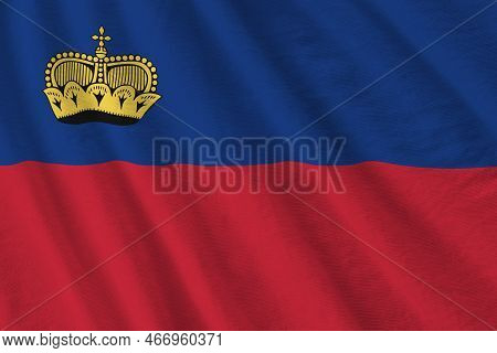 Liechtenstein Flag With Big Folds Waving Close Up Under The Studio Light Indoors. The Official Symbo