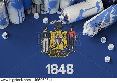 Wisconsin Us State Flag And Few Used Aerosol Spray Cans For Graffiti Painting. Street Art Culture Co