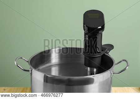 Sous Vide Cooker In Pot On Table, Closeup. Thermal Immersion Circulator