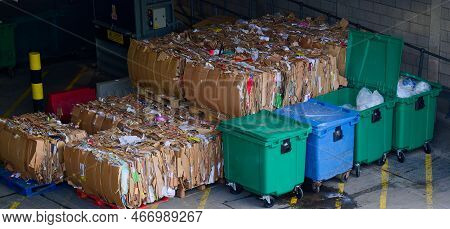 Cardboard And Rubbish In Waste Compound For Disposal At Dump Site