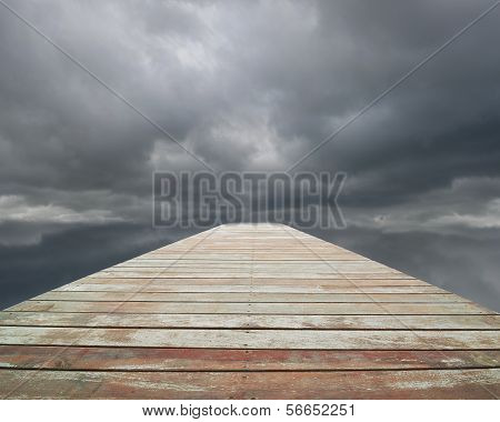 Wooden Way With Cloudy Sky And Spot In Front