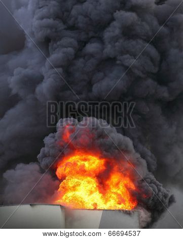 Flames and black smoke - air pollution concept.