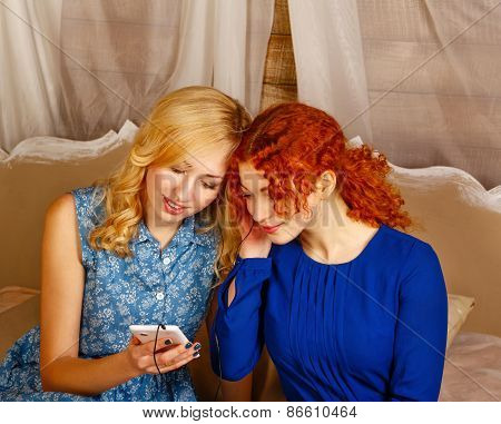Sisters Listening To Music On Headphones