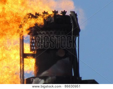 Torch system on an oil field