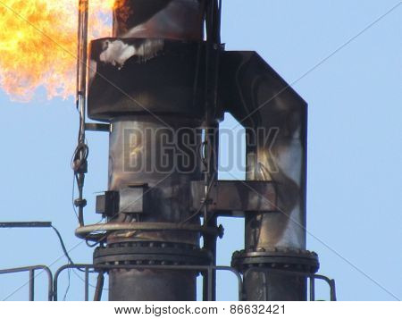Torch system on an oil field