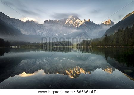 Alpine lake,Sunrise over the alpine lake Laghi di Fusine
