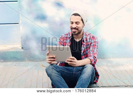 Man Using A Tablet.