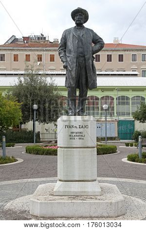 RIJEKA CROATIA - OCTOBER 17: Ivan Zajc Statue in Rijeka on OCTOBER 17 2014. Sculpture of Croatian Composer in Front of Opera and Ballet House in Rijeka Croatia.