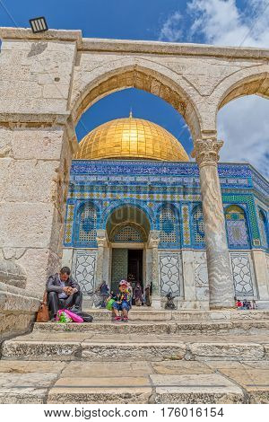 JERUSALEM, ISRAEL - MAY 23, 2016: Father and son visiting the Dome of the Rock, an Islamic shrine located on the Temple Mount in the Old City.