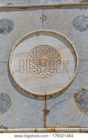 Relief of the white flower in circle on the wall of the Dome of the Rock an Islamic shrine located on the Temple Mount in the old city Jerusalem, Israel.