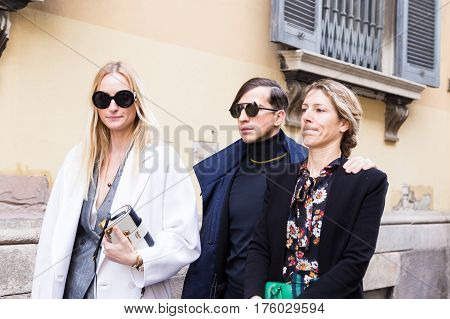 MILAN ITALY - FEBRUARY 25: Fashionable people pose outside Blumarine fashion show during Milan Women's Fashion Week on FEBRUARY 25 2017 in Milan.