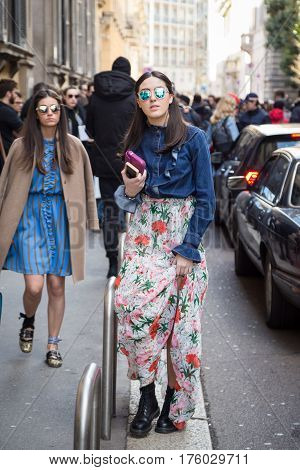 MILAN ITALY - FEBRUARY 25: Fashionable woman poses outside Blumarine fashion show during Milan Women's Fashion Week on FEBRUARY 25 2017 in Milan.